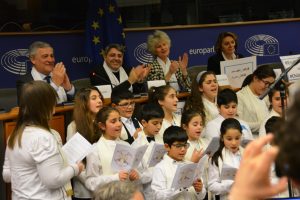 Belgium, Brussels, December 6, 2016  A Chaldean Catholic choir from Brussels sings a song of peace via Skype to the children in Aleppo during the ACN organised Skype conference between the European Parliament and Aleppo.